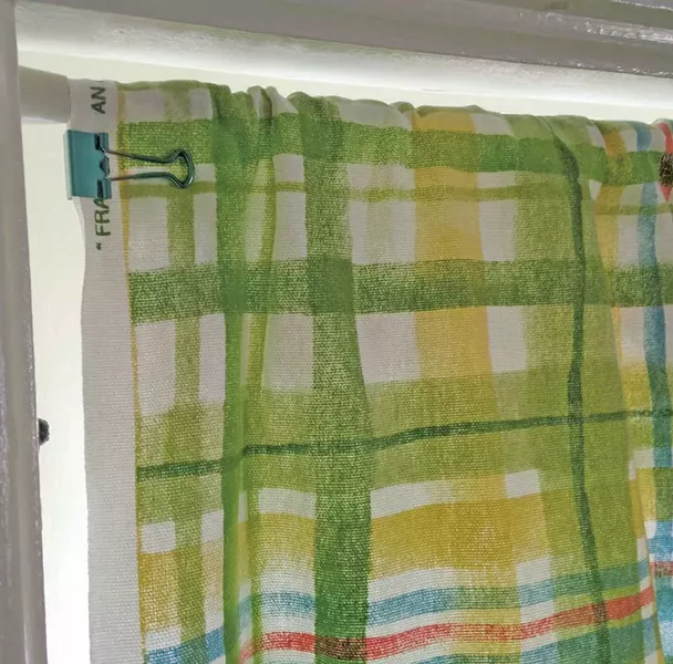 Cowan made her own budget-friendly curtains using binder clips and discount fabric. - COURTESY OF LIZA COWAN