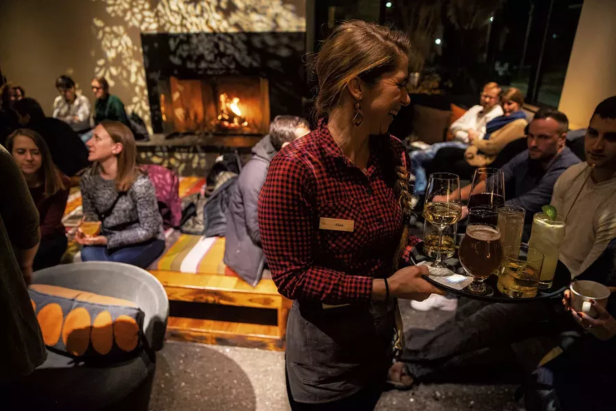 Drinks by the fireplace at Juniper - JAMES BUCK