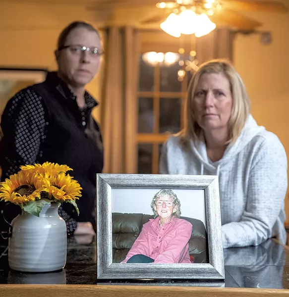 June (left) and Mary Kelly with a photo of their mother, Marilyn Kelly - JAMES BUCK