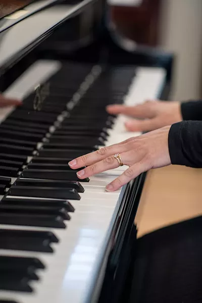 Emily Rose playing piano - CALEB KENNA