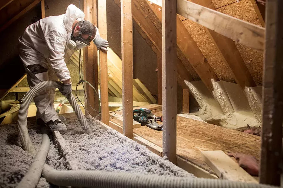 Installation of blow-in cellulose insulation - COURTESY OF EFFICIENCY VERMONT