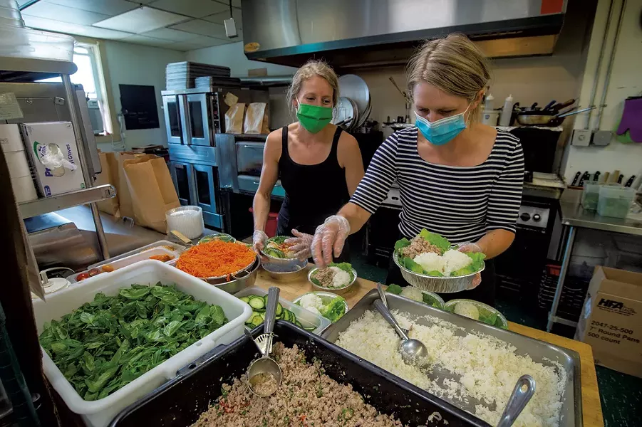 Kit Basom (left) and Jana Smart preparing pork larb - JEB WALLACE-BRODEUR