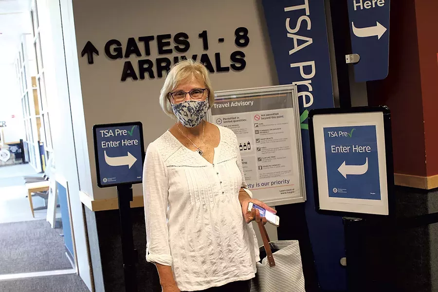 BTV airport commissioner Helen Riehle getting ready to board a flight to Detroit - COURTNEY LAMDIN ©️ SEVEN DAYS