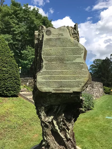 Greg Wyatt's bronze sculpture of Thomas Moran, which includes a biography of Moran - SALLY POLLAK ©️ SEVEN DAYS