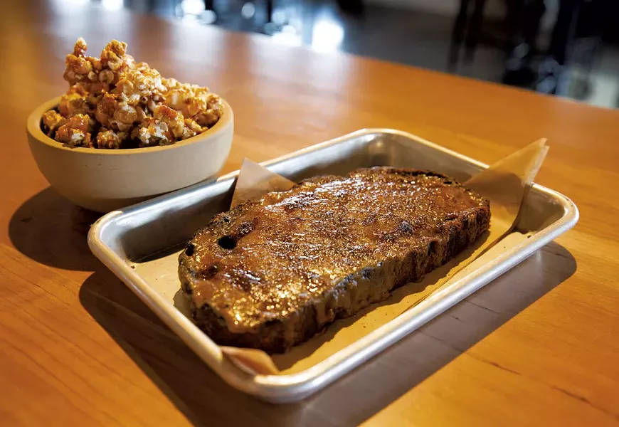 Bourbon caramel popcorn (left) and Welsh rarebit - JAMES BUCK