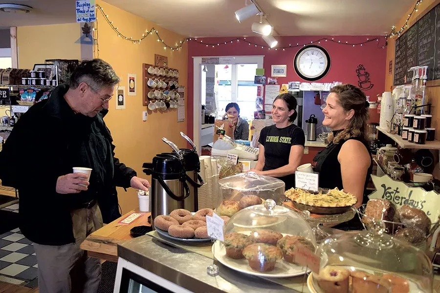 Sarah Copeland Hanzas, right, talks with Bruce Murray at the Local Buzz, her Bradford café - TERRI HALLENBECK