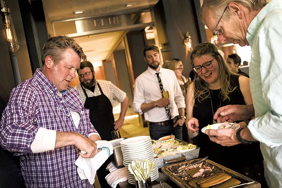 John Brawley shucking oysters - COREY HENDRICKSON