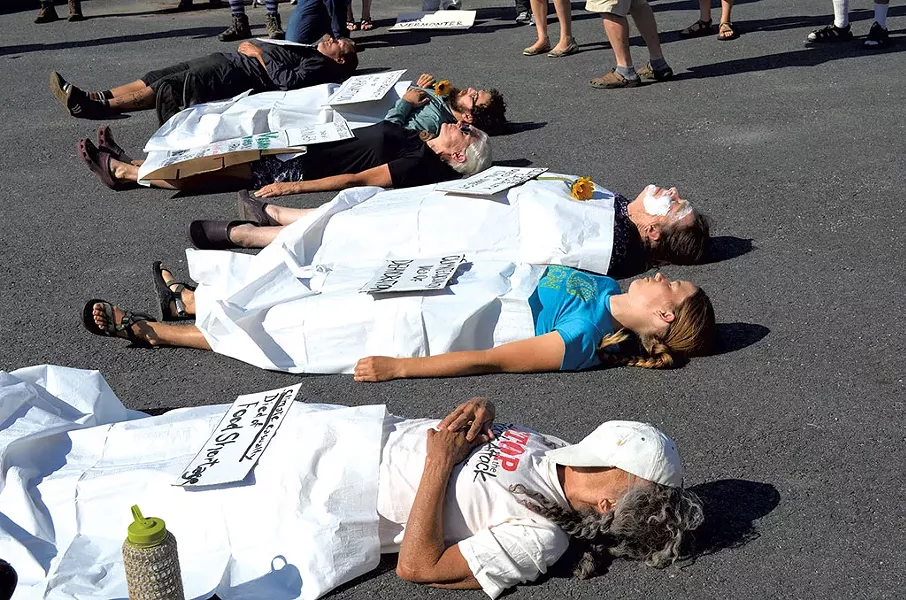 Protesters staging a "die-in" - ALICIA FREESE