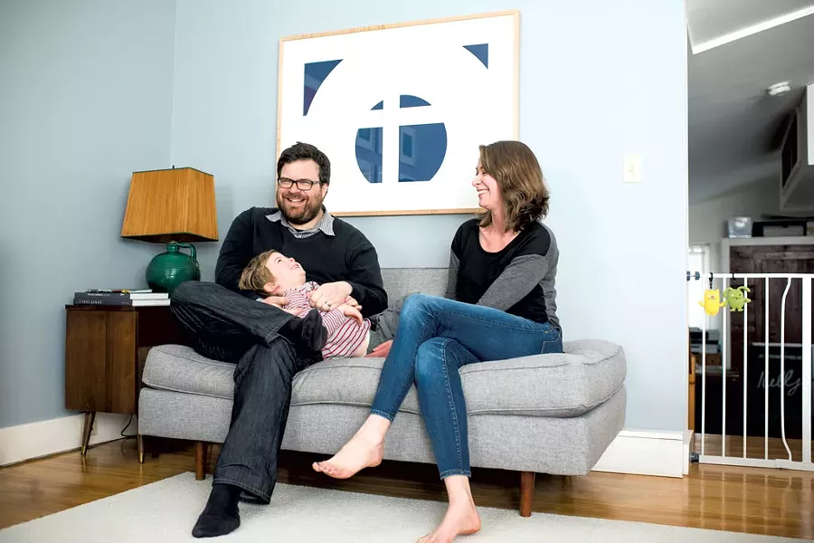 Jason and Dana Routhier at home; "SS K-80" by Nassos Daphnis hangs over the couch - COURTESY OF SHELBURNE MUSEUM