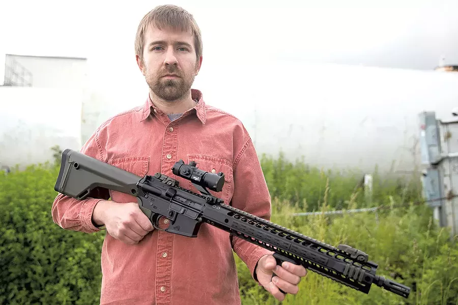 Paul Heintz with the AR-15 - FILE: JAMES BUCK