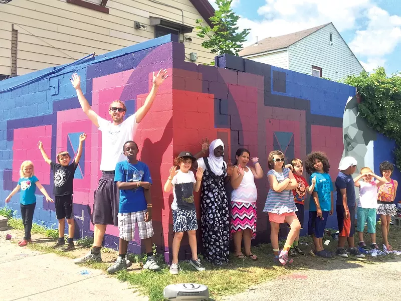 Sloan Collins and his helpers in front of a mural supported by the BCA Community Fund - COURTESY OF BURLINGTON CITY ARTS