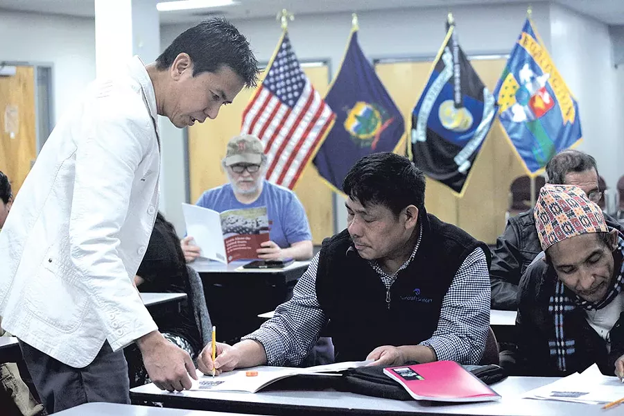 Hemant Tamang-Ghising teaching a citizenship class - MATTHEW THORSEN