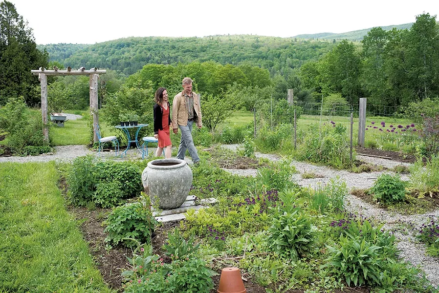 Sam and Kathryn Wyatt in their Lincoln home's front gardens - CALEB KENNA