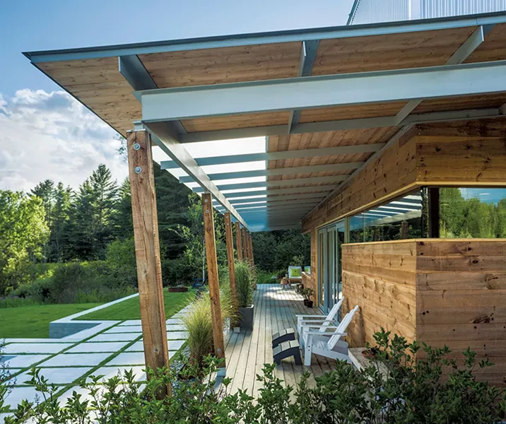The outside deck showcases the home's floor-to-ceiling windows and doors. - JIM WESTPHALEN