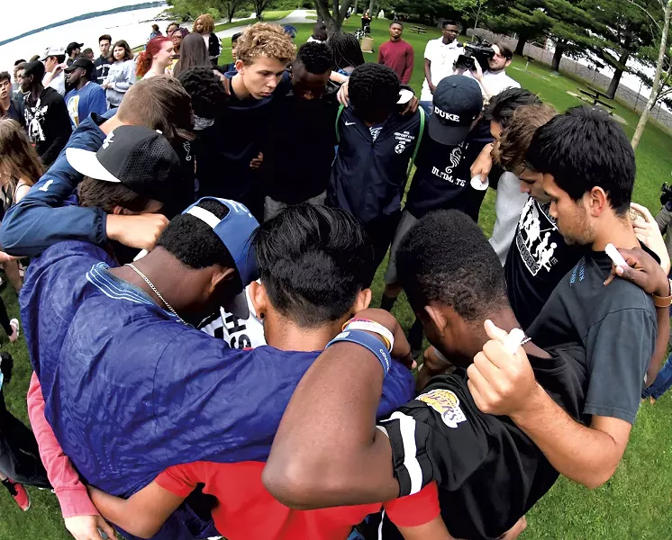 Friends remembering Christian Kibabu at the vigil in Oakledge Park - LEE KROHN