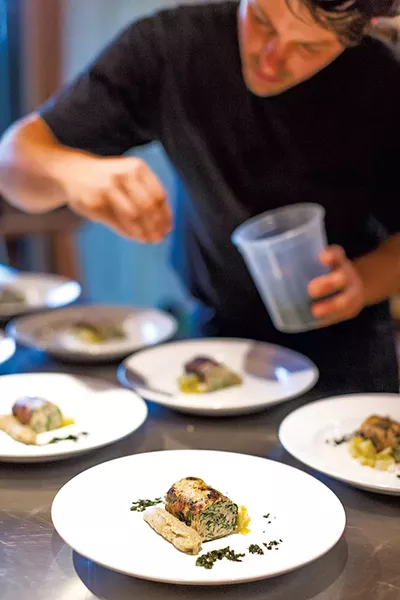 Taylor LaFleur preparing a meal in Keene, N.Y. - COURTESY OF BEN STECHSCHULTE