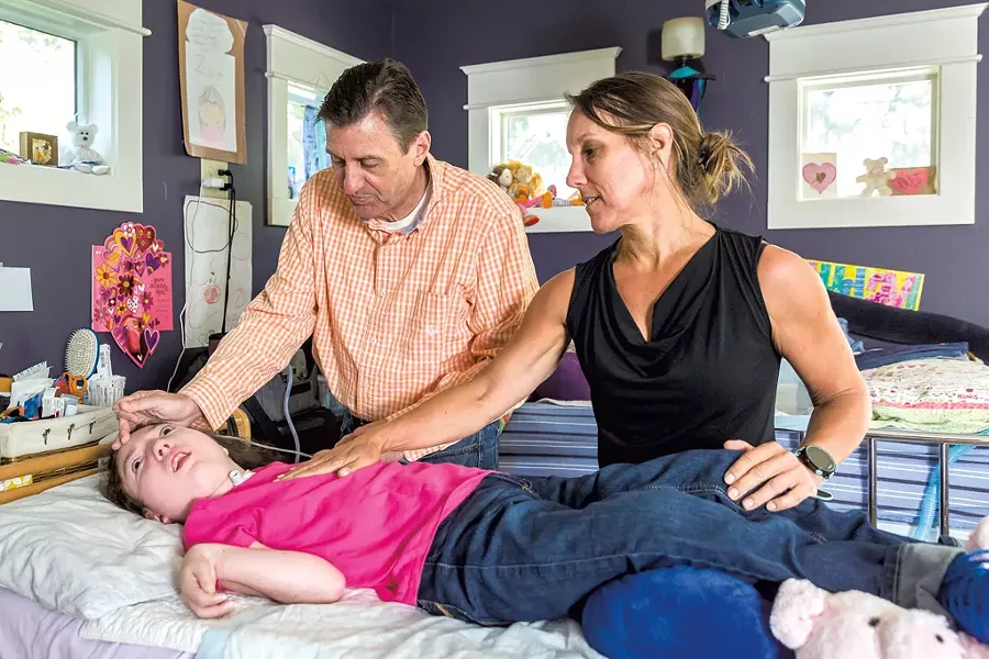 Erika and David Nestor with their daughter, Zoe, in their house