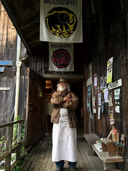 Peter Schumann at the entrance to the Bread and Puppet museum - SALLY POLLAK