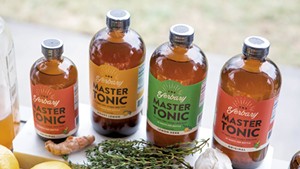 Fresh ingredients and finished Yerbary Master Tonic products