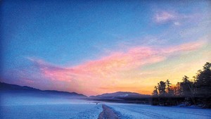 Frozen trail on Lake Morey at sunrise