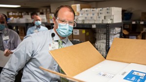 Wesley McMillian, director of pharmacy at UVM Medical Center, with a shipment of vaccine