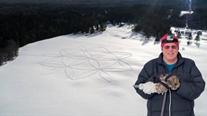 John Predom with one of his snowshoe art creations