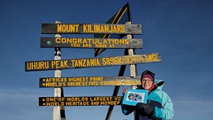 Rebekah Thomas atop Mount Kilimanjaro