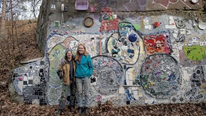 Corrine Yonce (left) and Mary Lacy at their new mosaic along the Burlington bike path