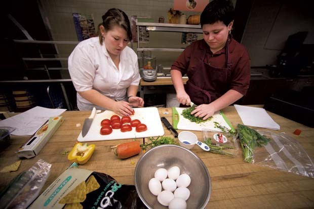 Susan Brace, 19, and Walker Whittemore, 12, prepare for Jr. Iron Chef Vermont at Mount Abraham Union Middle-High School in Bristol.