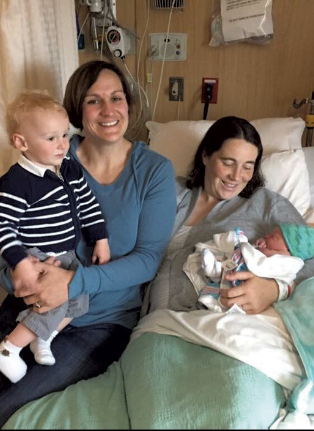 Julie Sloan (right), holding baby Owen, with her wife, Amy Welch, and son Lucas - COURTESY OF JULIE SLOAN