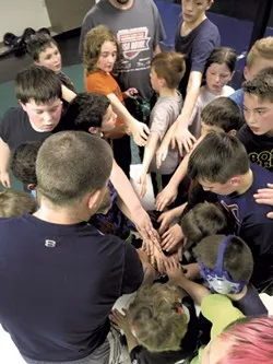 The Cobras huddle - MATTHEW THORSEN