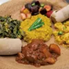Ethiopian and Eritrean lentils, carrots, beets and potatoes, collard greens, curried chicken, and spicy potatoes, served on injera bread, for a takeout dinner at the O'Brien Community Center Ethiopian and Eritrean lentils, carrots, beets and potatoes, collard greens, curried chicken, and spicy potatoes, served on injera bread, for a takeout dinner at the O'Brien Community Center