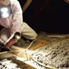 Brian Hyde of Energy Co-op of Vermont sealing gaps in a Colchester attic Brian Hyde of Energy Co-op of Vermont sealing gaps in a Colchester attic