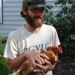 Will Bennington with a chicken