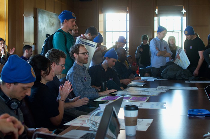 Postdocs United occupying the conference room.