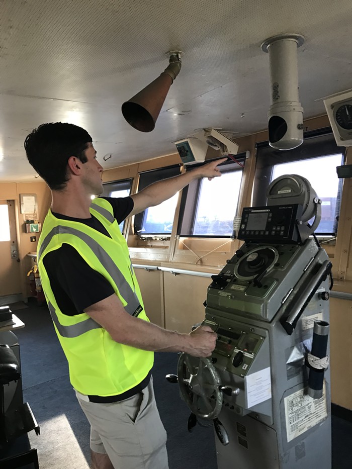 In the olden days, captains could communicate with workers on deck by talking into that little horn you see above my stupid head.