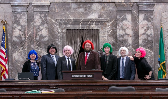 Senate Majority Floor Leader Marko Liias (red wig) and his staff in the Senate chamber.