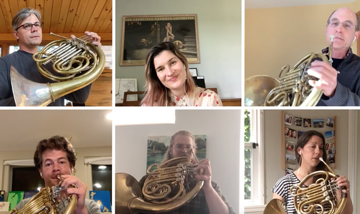 Danielle Kuhlmann, in the top center, usually plays French horn, but this morning she sings for us.