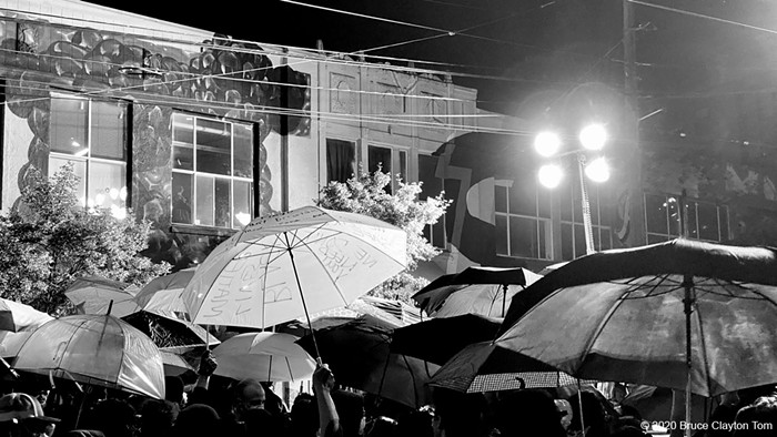 The umbrellas on the front line after SPD switched on their large lights.