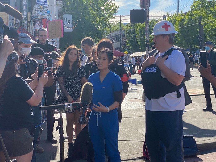 Volunteer medic and Registered Nurse Kim Dang talks about treating Aubreanna Inda, who is believed to have nearly died after being struck by a flash-bang grenade thrown by SPD officers. Volunteer medic and Registered Nurse Kim Dang talks about treating Aubreanna Inda, who is believed to have nearly died after being struck by a flash-bang grenade thrown by SPD officers.