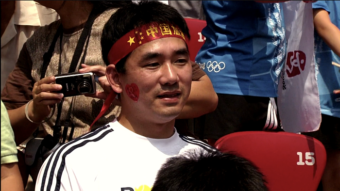 This guy in the crowd was the biggest Liu Xiang fan. I keep thinking of his stunned and dejected face after Liu quit the race due to an injury. This guy in the crowd was the biggest Liu Xiang fan. I keep thinking of his stunned and dejected face after Liu quit the race due to an injury.