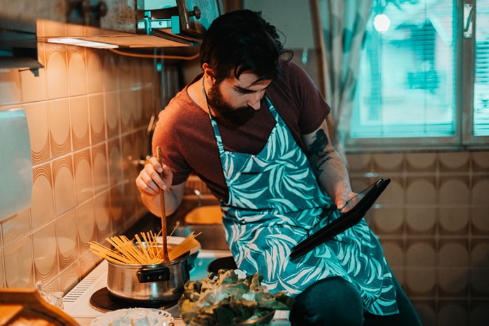 A portrait of the author cooking while stoned.