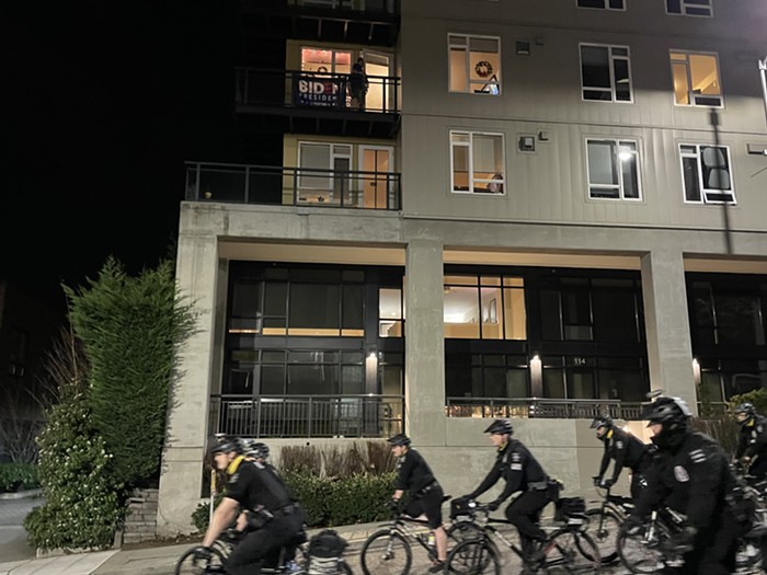 A Biden stan watches on as cops follow a group of antifascists away from the Seattle Center. I didnt think anything could make me miss the Rep, but last nights tour though the Seattle Center made me want to sit for a five-hour production of A Raisin in the Sun.