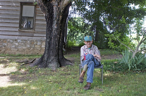 A roadside stop in Vesuvius: John Henry Campbell, 77, spends and afternoon drinking Budweiser in his front yard.