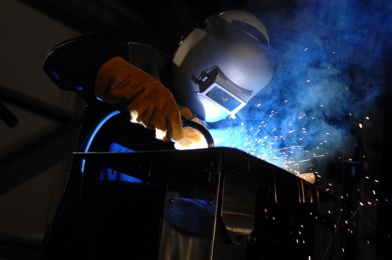 A worker welds the keel of an aircraft carrier at Northrop Grumman Shipbuilding in Newport News. - U.S. NAVY