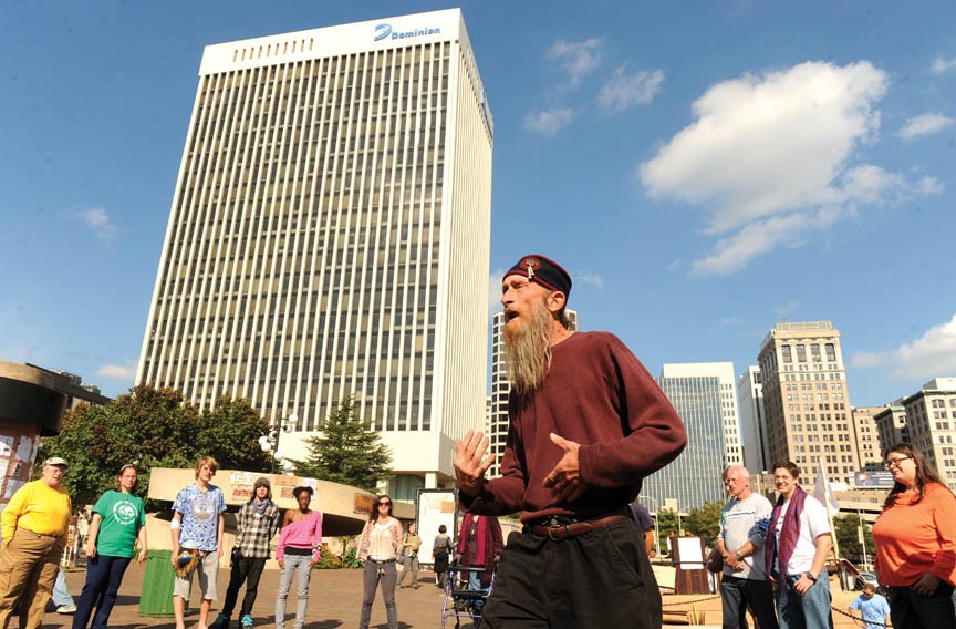 Day 9 of Occupy Richmond’s protest at Kanawha Plaza downtown begins with a spirit circle led by local activist Farid Alan Schintzius. - SCOTT ELMQUIST