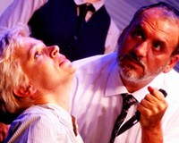 Death on the installment plan: Antonia (Kim Jones Clark) is seriously reconsidering the contract she signed with Shylock (Jeff Clevenger) in this intense scene from Henley Street's production of "The Merchant of Venice."