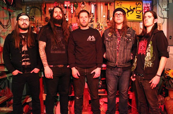 Doom metal band Howl and vocalist Vincent Hausman (center) are now available as a big sloppy burger at Chicago restaurant Kuma's Corner &mdash; next time you're in the Windy City.