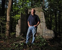 Historian Selden Richardson stands at the ruins of Club Forest in Goochland County, the one-time hangout of the Tri-State Gang.
