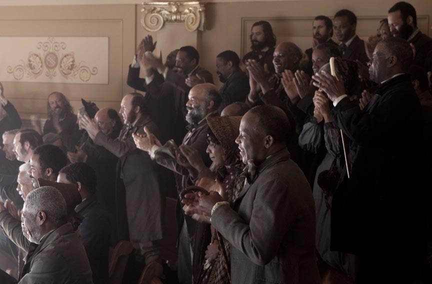 In the balcony of Virginia's House of Delegates, which doubles as the chamber of U.S. Congress, the writer &mdash; several rows from left &mdash; joins extras playing onlookers who celebrate the passage of the 13th Amendment. - DREAMWORKS PICTURES